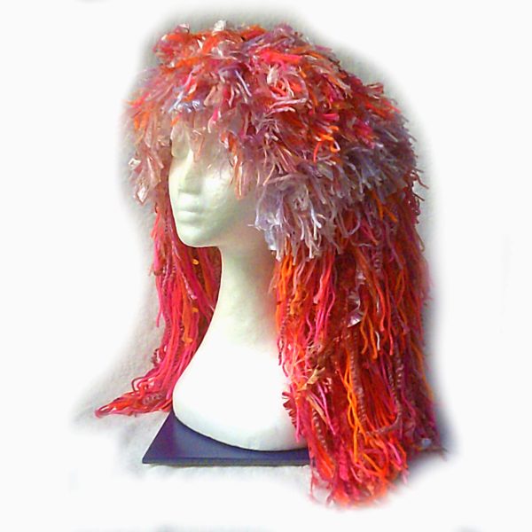 Pick Me Pink, a handmade crochet wig beanie in pink and orange tones.