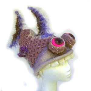 The Sequinned Snapper crochet poseable fish hat with sparkly sequins and a big toothy grin